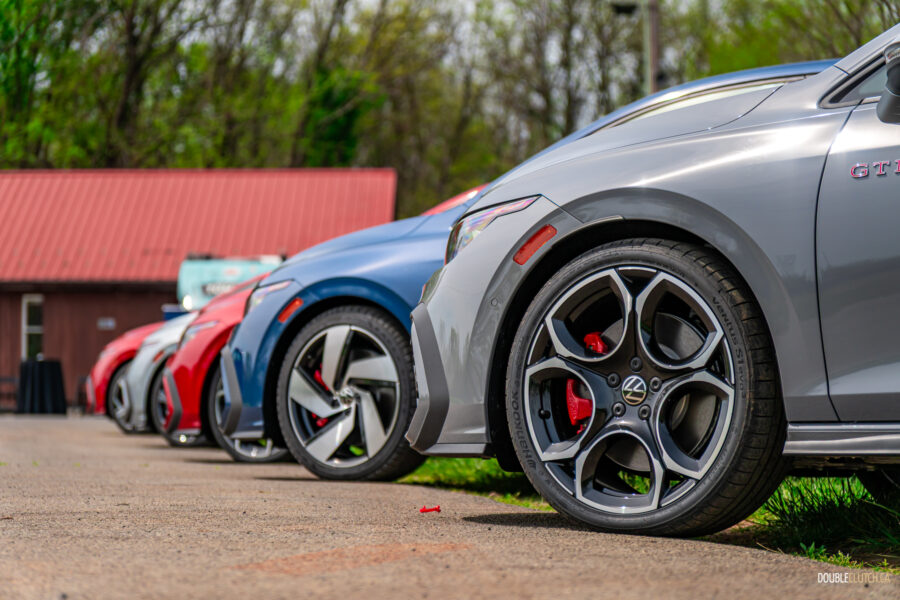 2025 Volkswagen Golf GTI lined up in a row at a racetrack